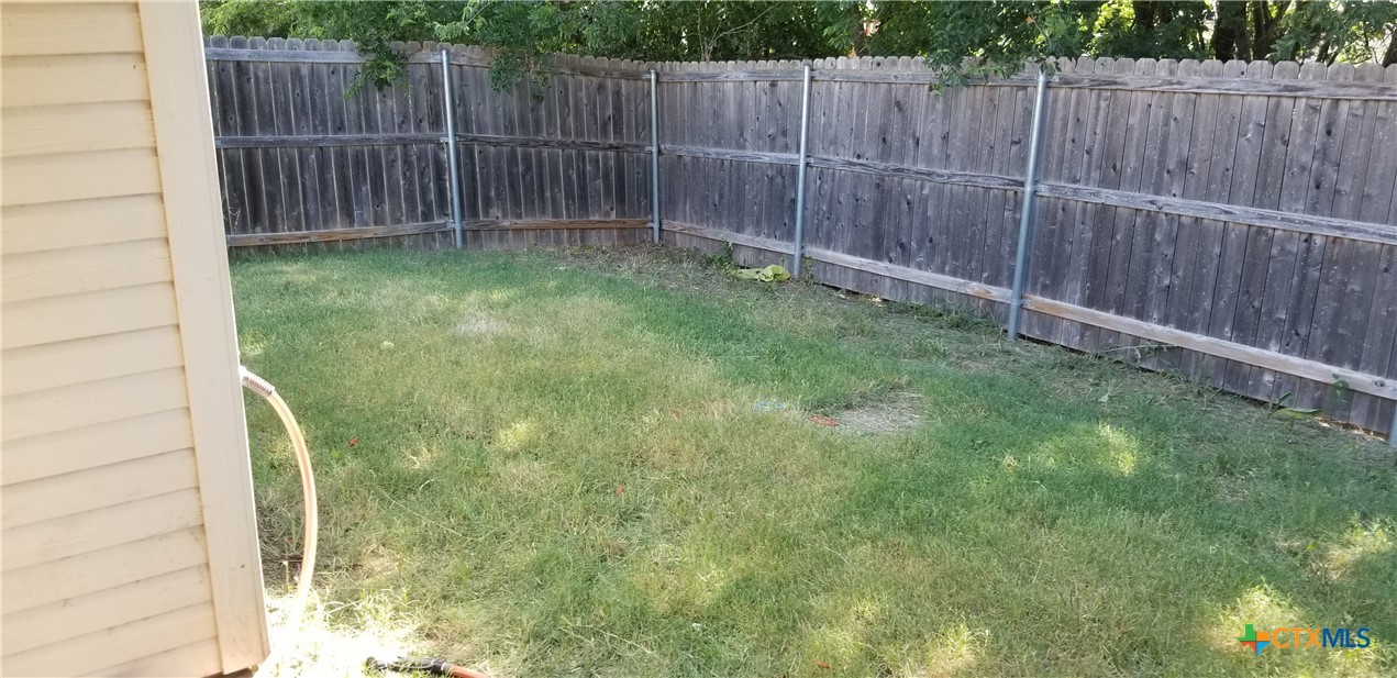 4606 Waterproof Drive, Unit A Killeen, TX 76549 - Photo 13 of 13 a view of a backyard with wooden fence