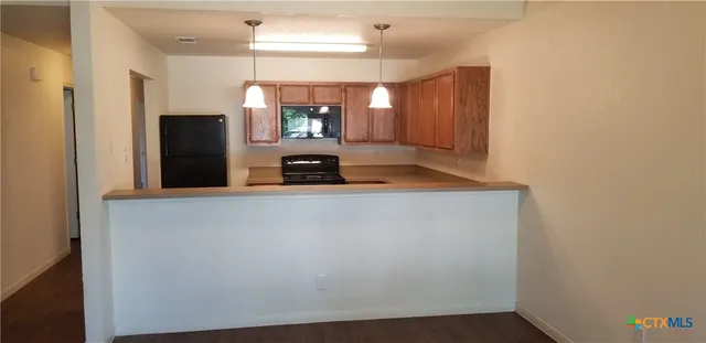 a view of a kitchen with a sink