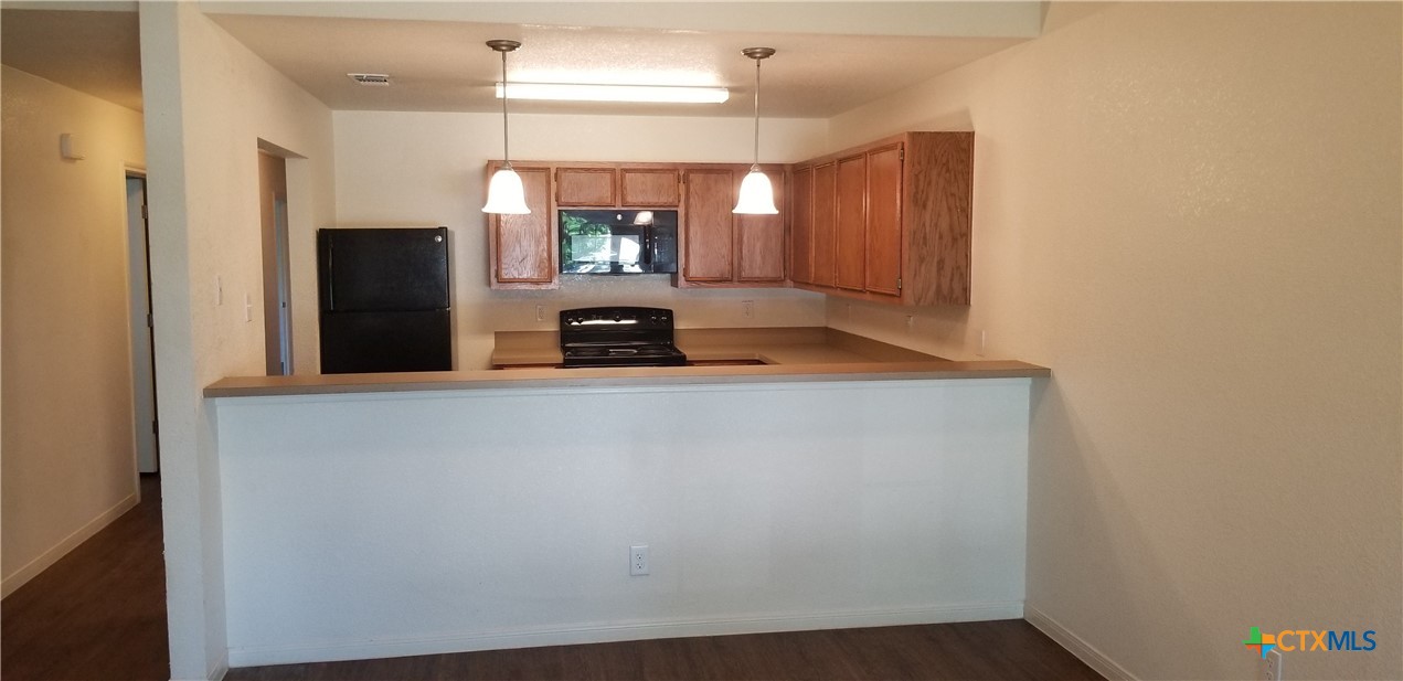 4606 Waterproof Drive, Unit A Killeen, TX 76549 - Photo 6 of 13 a view of a kitchen with a sink