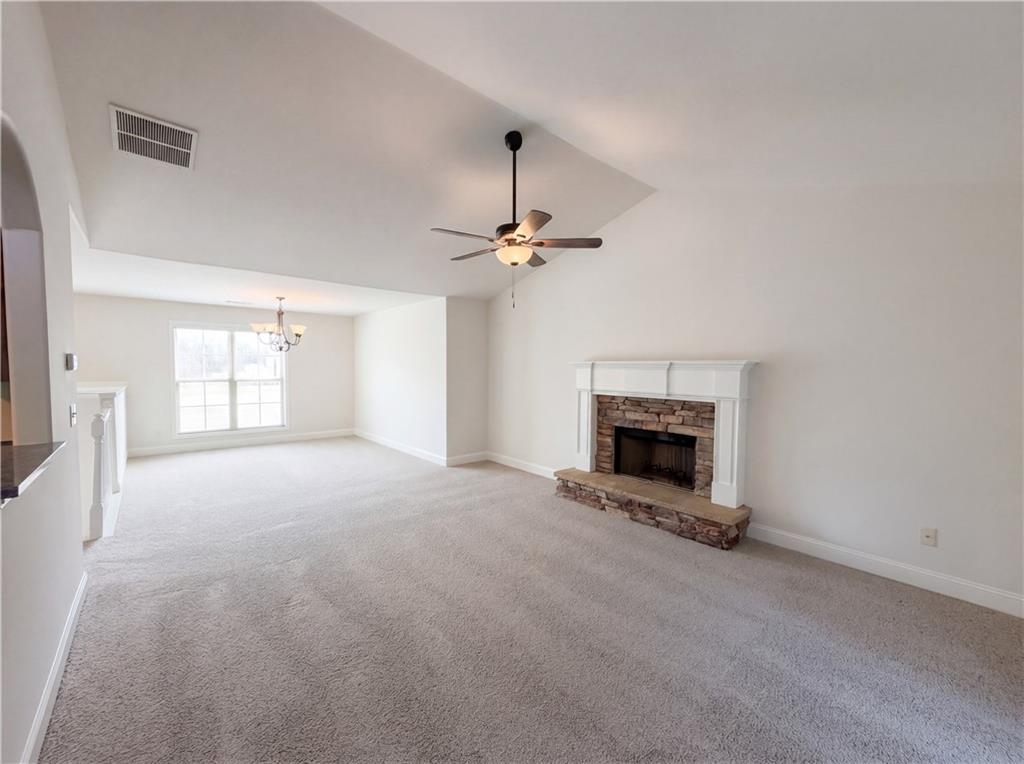 1948 Paynes Point Winder, GA 30680 - Photo 8 of 22 a view of an empty room with a fireplace and a window
