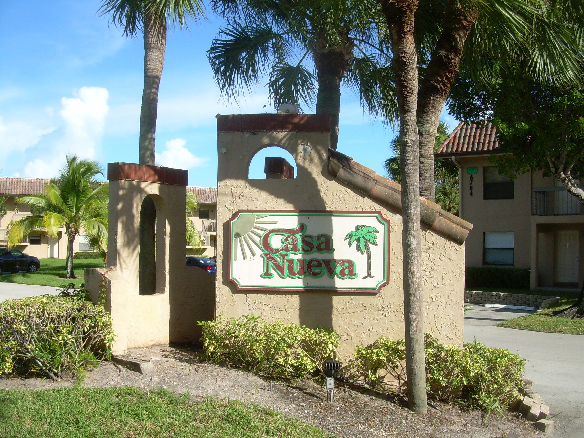 6772 Palmetto Circle South, Unit 104 Boca Raton, FL 33433 - Photo 17 of 17 a front view of a house with garden