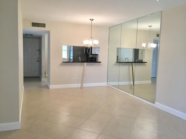 a view of a livingroom with a flat screen tv and outdoor view