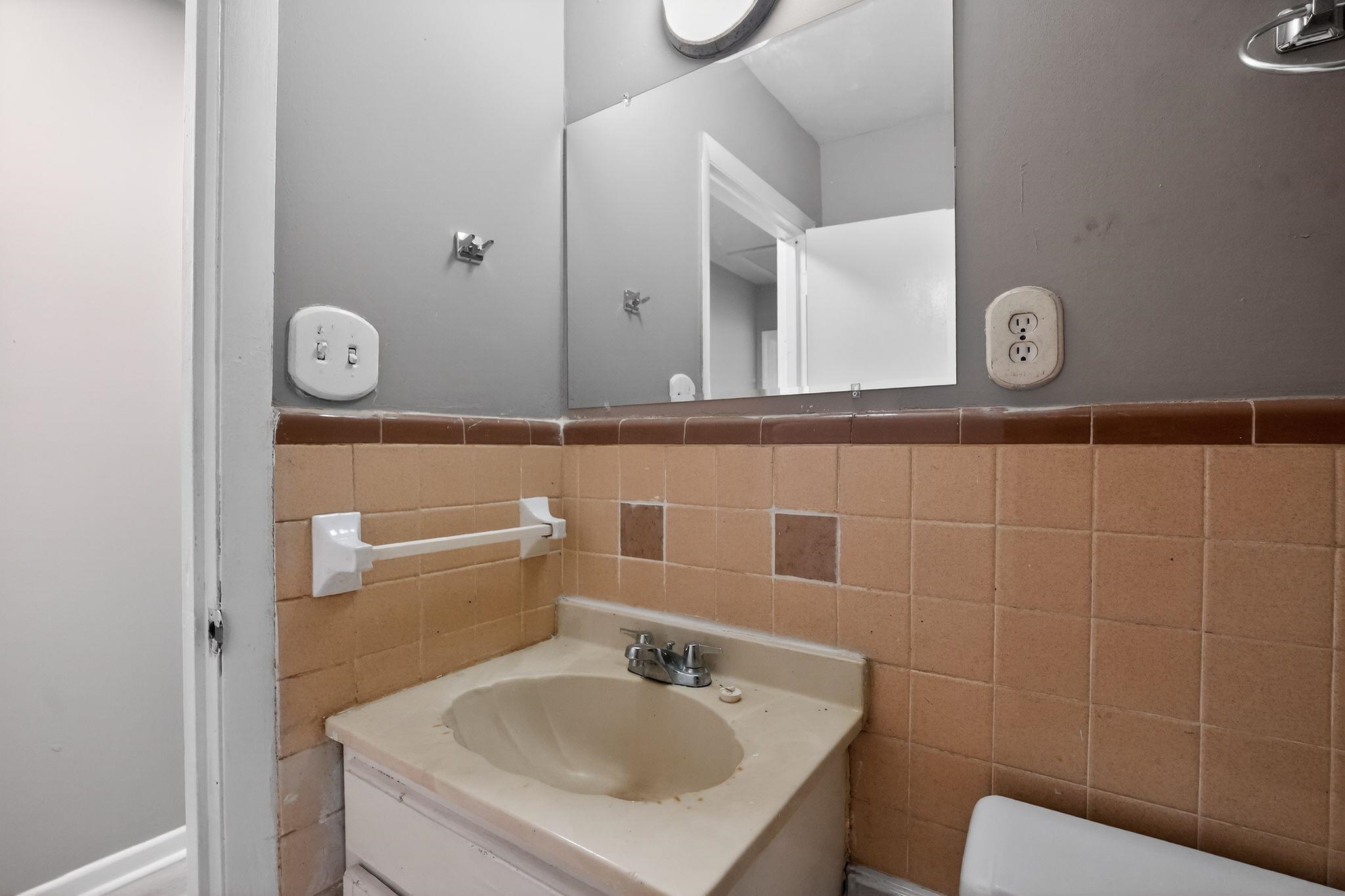 3445 Powers Road Memphis, TN 38128 - Photo 31 of 35 Bathroom vanity featuring an integrated sink with a chrome faucet