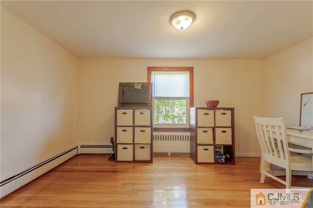 297 Washington Road Sayreville, NJ 08872 - Photo 11 of 44 a view of kitchen with furniture and wooden floor