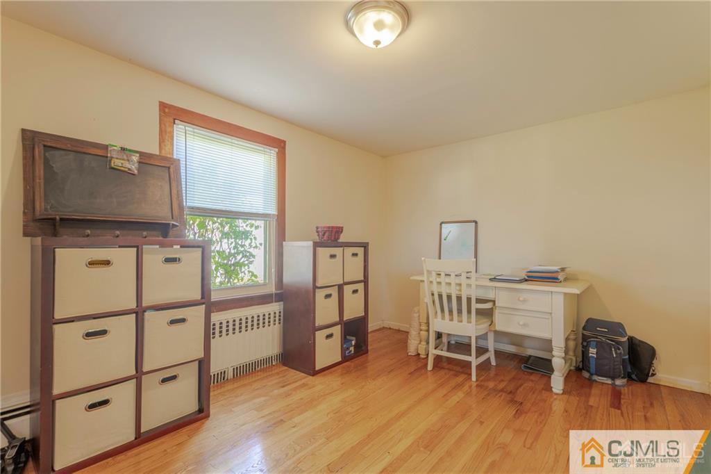 297 Washington Road Sayreville, NJ 08872 - Photo 12 of 44 a room with furniture a rug and a window