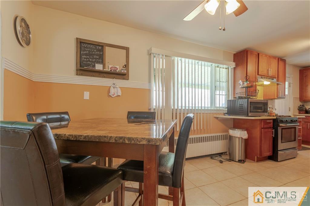 297 Washington Road Sayreville, NJ 08872 - Photo 14 of 44 a view of a dining room with furniture window and outside view