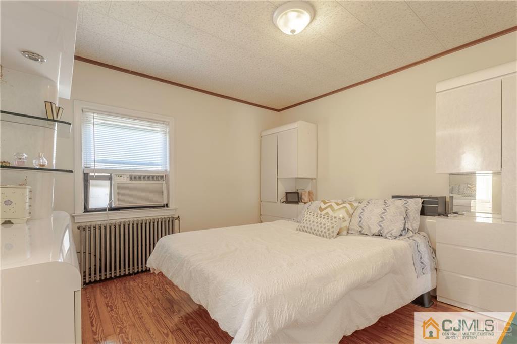 297 Washington Road Sayreville, NJ 08872 - Photo 23 of 44 a bedroom with a bed and a window