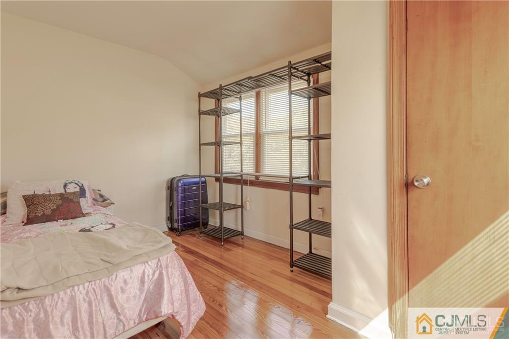 297 Washington Road Sayreville, NJ 08872 - Photo 27 of 44 a bedroom with a bed and a window