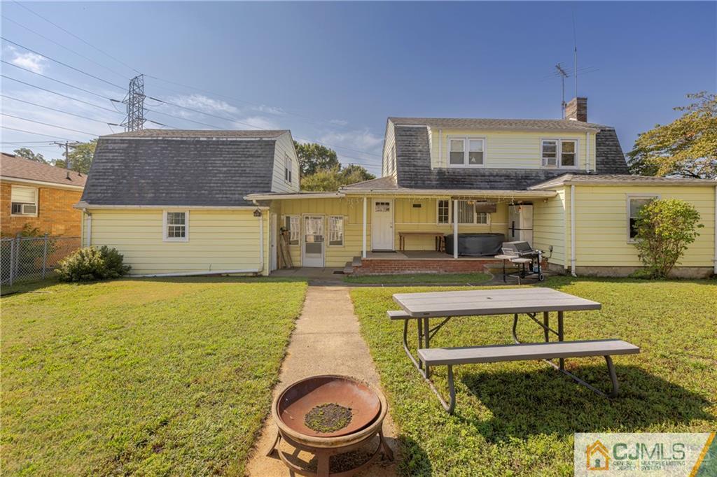 297 Washington Road Sayreville, NJ 08872 - Photo 39 of 44 a front view of a house with swimming pool outdoor seating and yard