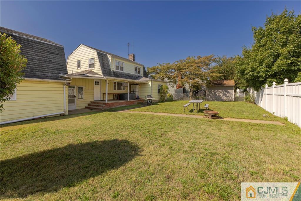 297 Washington Road Sayreville, NJ 08872 - Photo 40 of 44 a view of a house with a yard