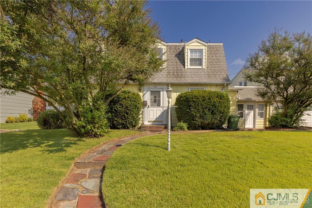297 Washington Road Sayreville, NJ 08872 - Photo 4 of 44 a view of a brick house with a yard