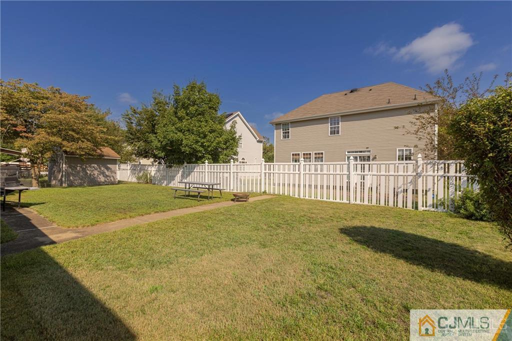297 Washington Road Sayreville, NJ 08872 - Photo 41 of 44 a view of a house with backyard and trees