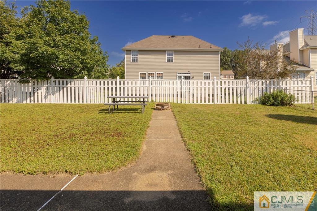 297 Washington Road Sayreville, NJ 08872 - Photo 44 of 44 a view of a pathway with a wrought fence