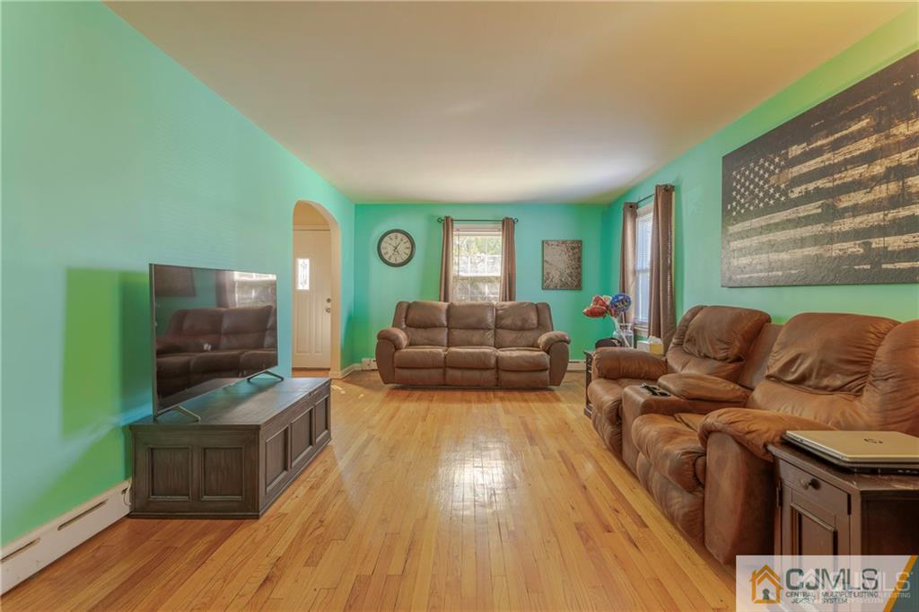 297 Washington Road Sayreville, NJ 08872 - Photo 8 of 44 a living room with furniture and a flat screen tv