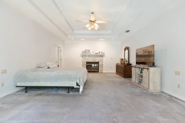 a view of walk in closet with clothes