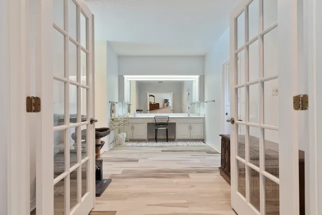 a living room with furniture a dining table and chairs with kitchen view