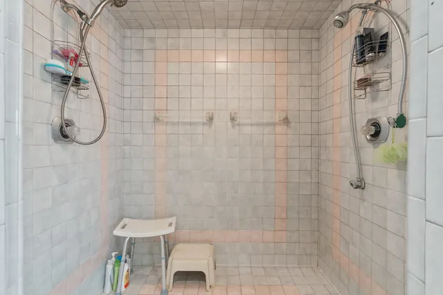 a kitchen with stainless steel appliances kitchen island granite countertop a table chairs sink and cabinets