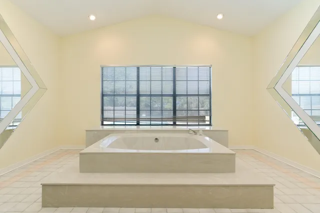 a kitchen with stainless steel appliances granite countertop a stove a sink dishwasher and a refrigerator