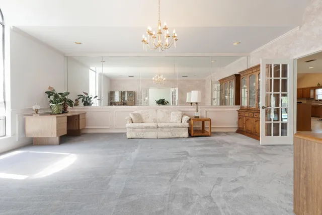 a bathroom with a sink vanity mirror and toilet