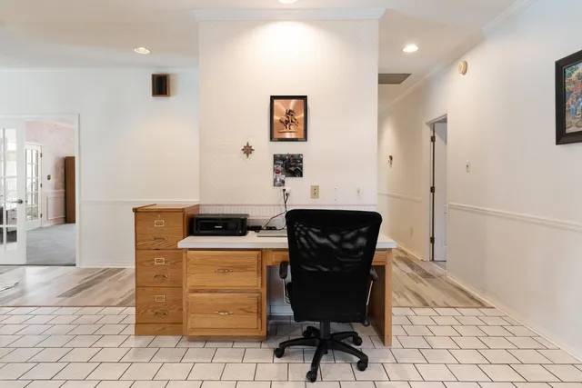 a picture of a bench in front of a house