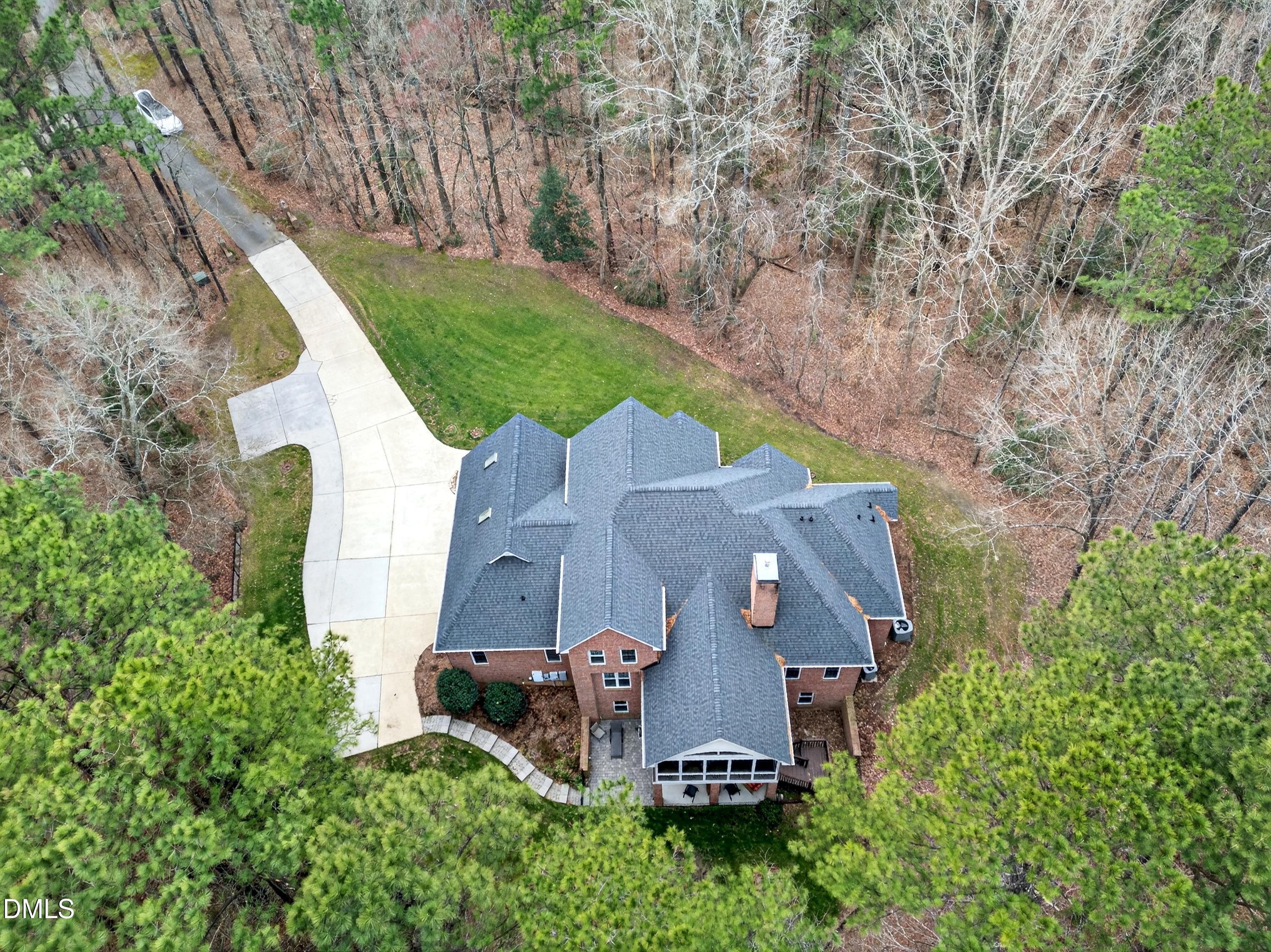 4613 Cross Brook Lane Raleigh, NC 27610 - Photo 3 of 53 an aerial view of a house with a garden and a trees