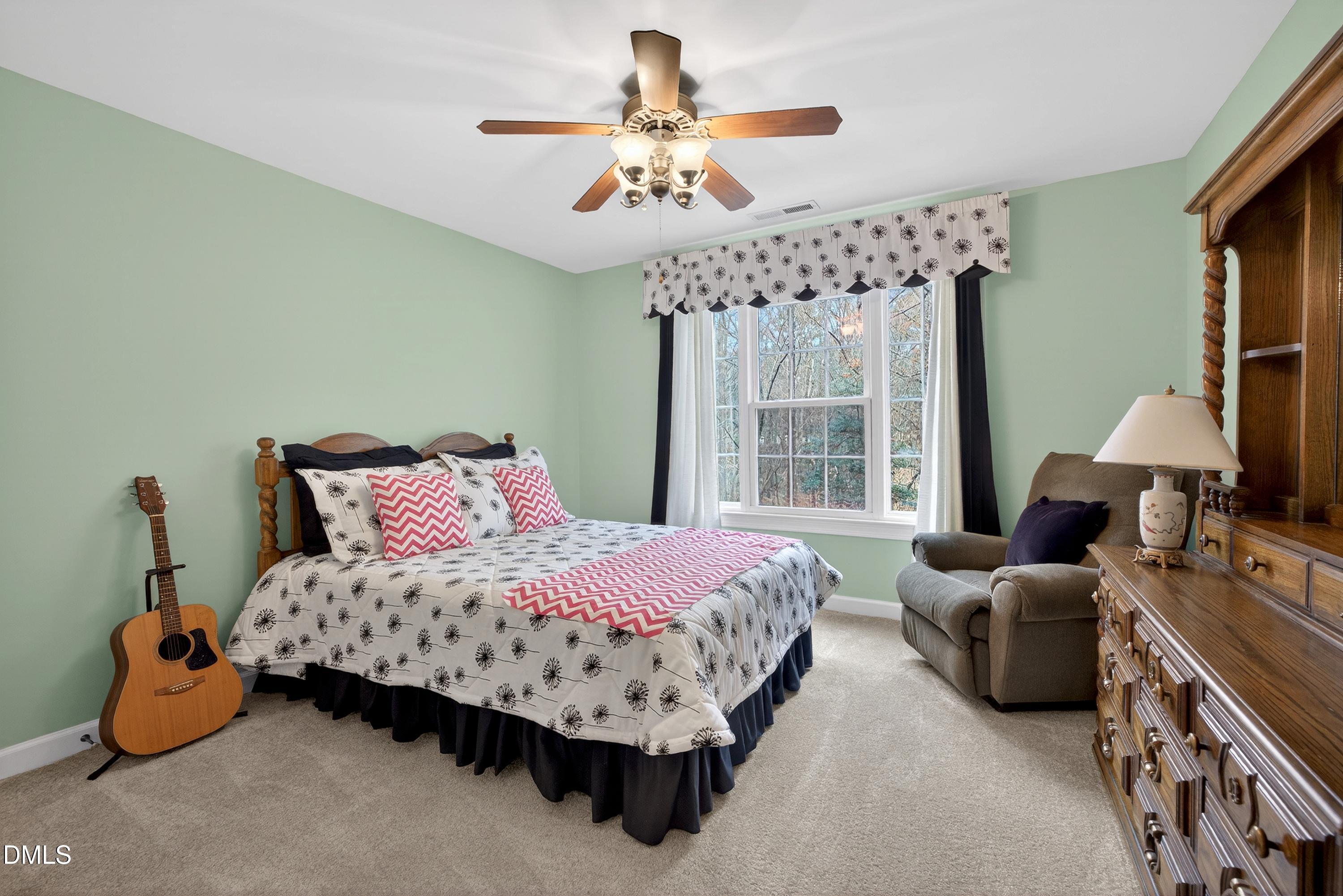 4613 Cross Brook Lane Raleigh, NC 27610 - Photo 31 of 53 a bedroom with bed and window