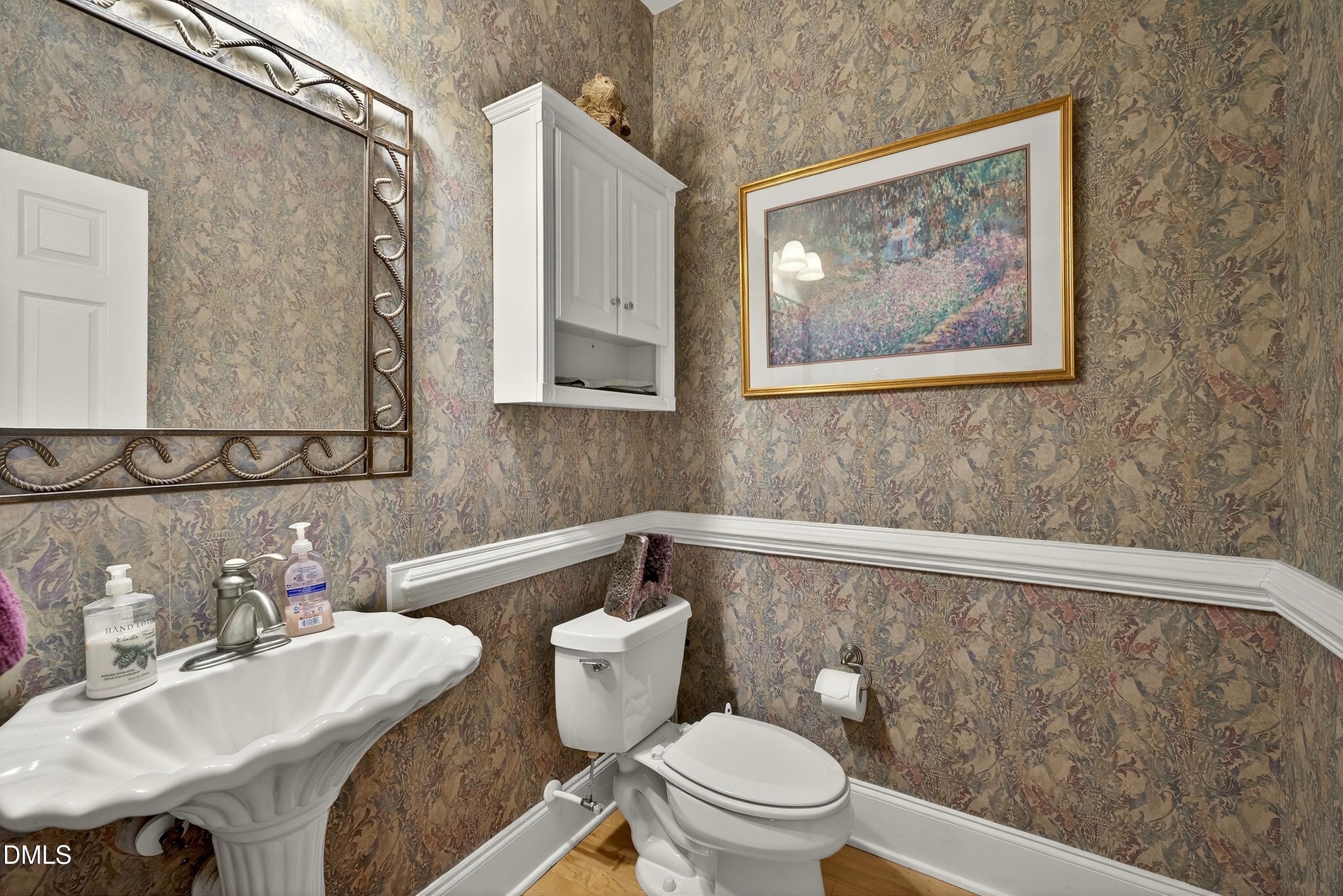 4613 Cross Brook Lane Raleigh, NC 27610 - Photo 33 of 53 a bathroom with a toilet a sink and bathtub