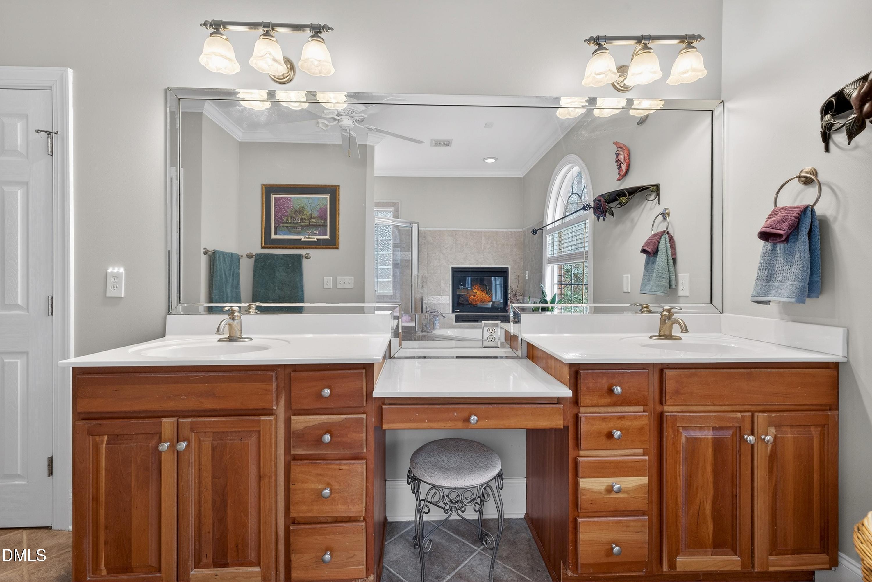 4613 Cross Brook Lane Raleigh, NC 27610 - Photo 36 of 53 a bathroom with a granite countertop double vanity sink and a mirror