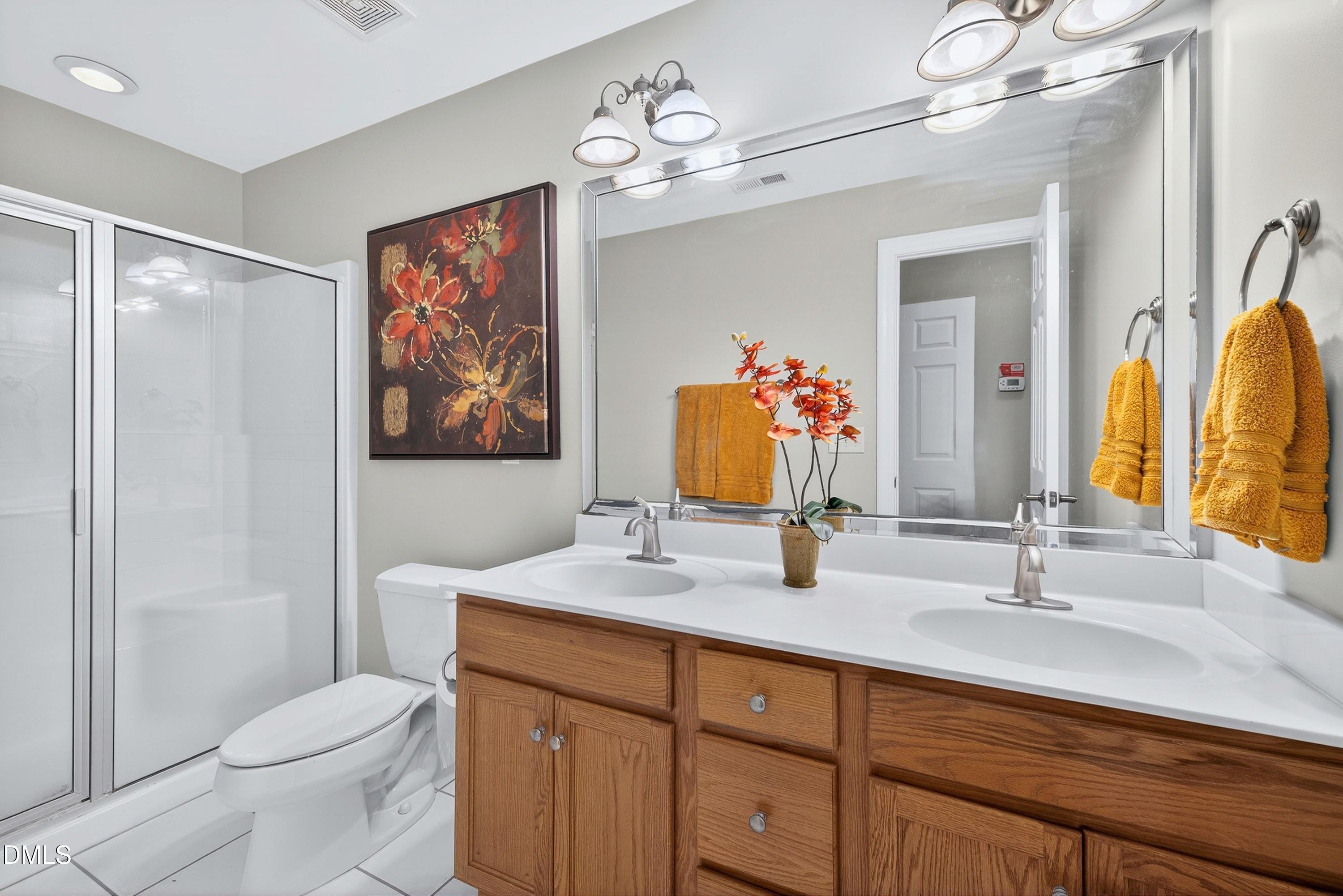 4613 Cross Brook Lane Raleigh, NC 27610 - Photo 37 of 53 a bathroom with a toilet a sink and a mirror