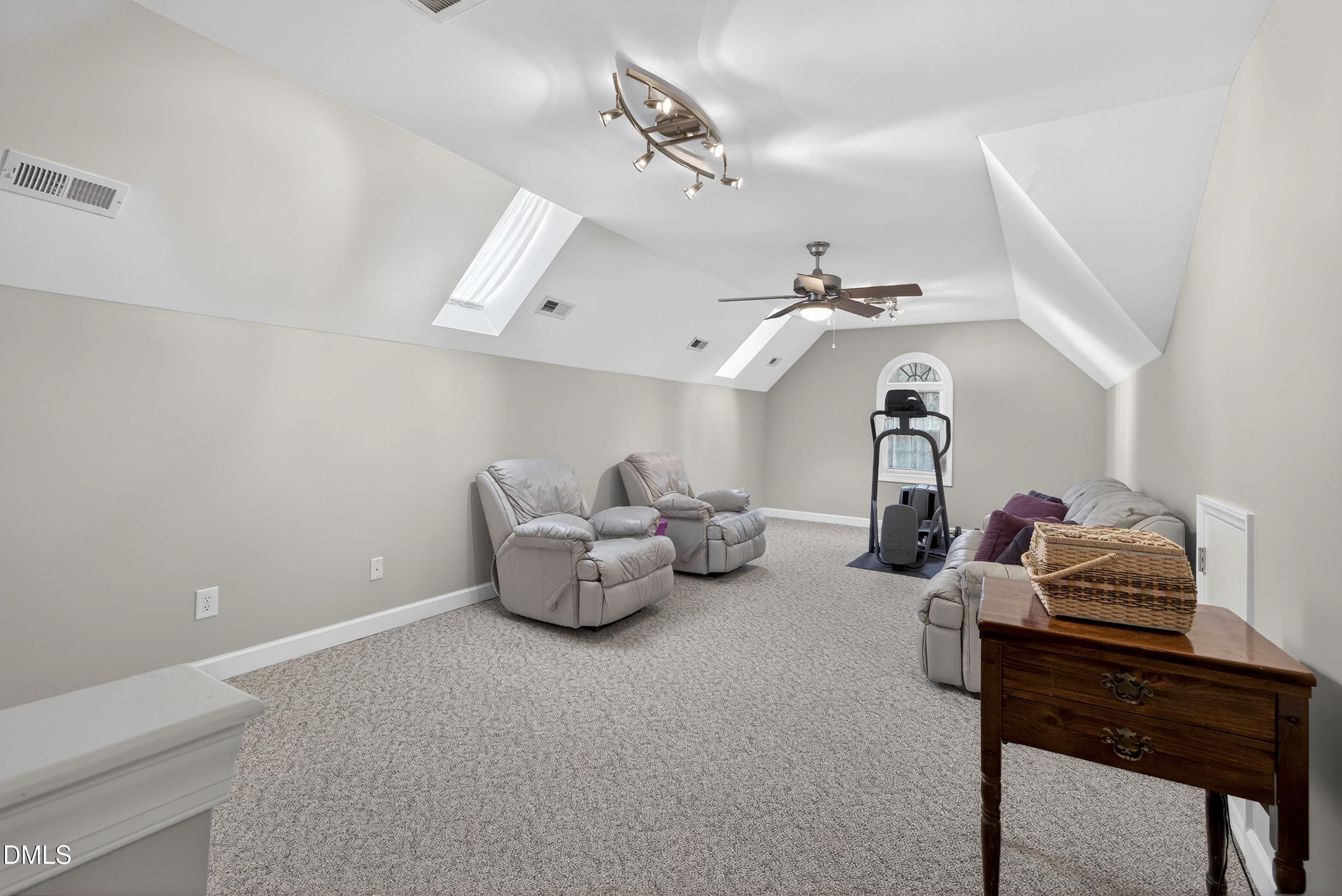 4613 Cross Brook Lane Raleigh, NC 27610 - Photo 38 of 53 a living room with lots of furniture and a chandelier