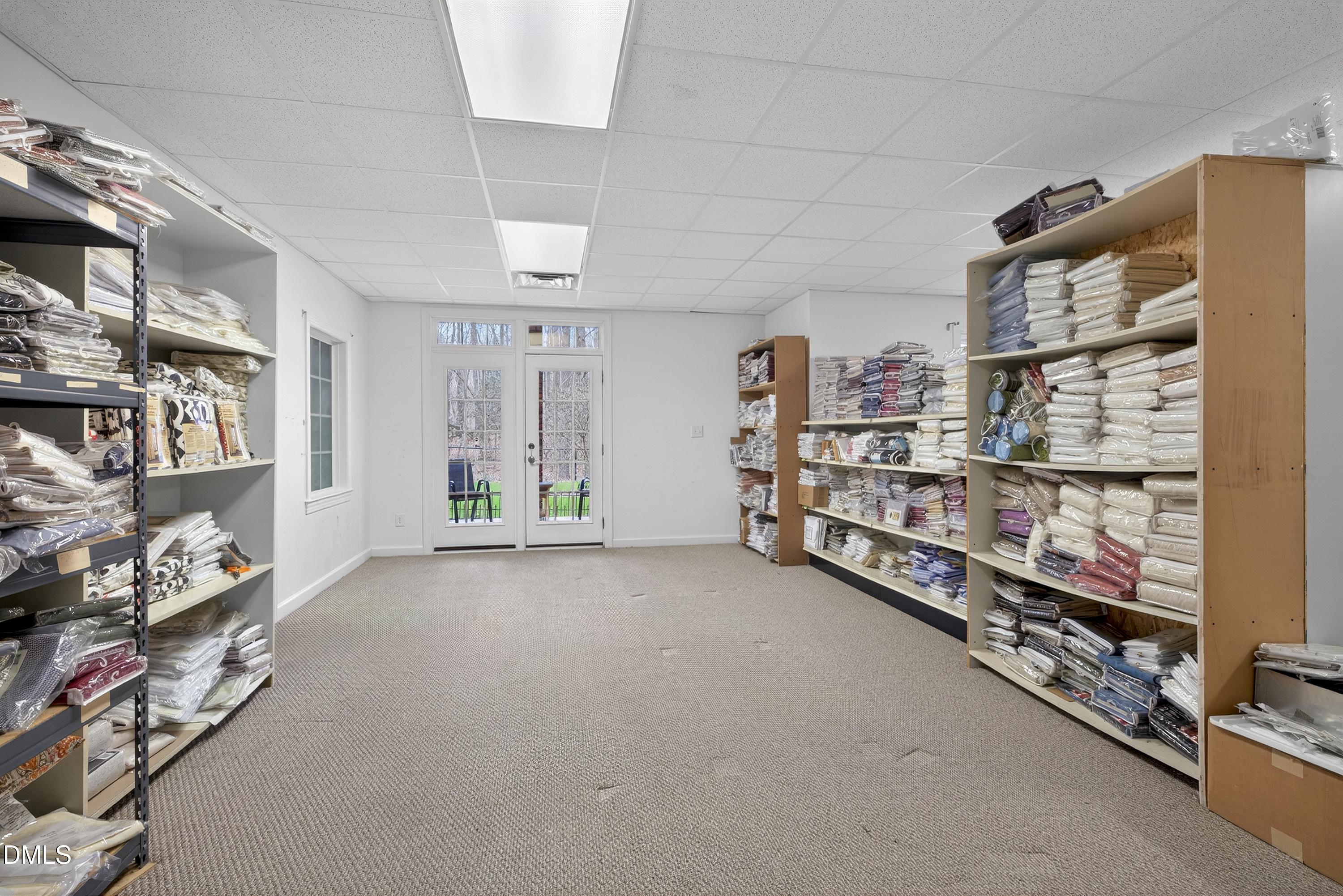 4613 Cross Brook Lane Raleigh, NC 27610 - Photo 40 of 53 a big room with lots of different colored cloths