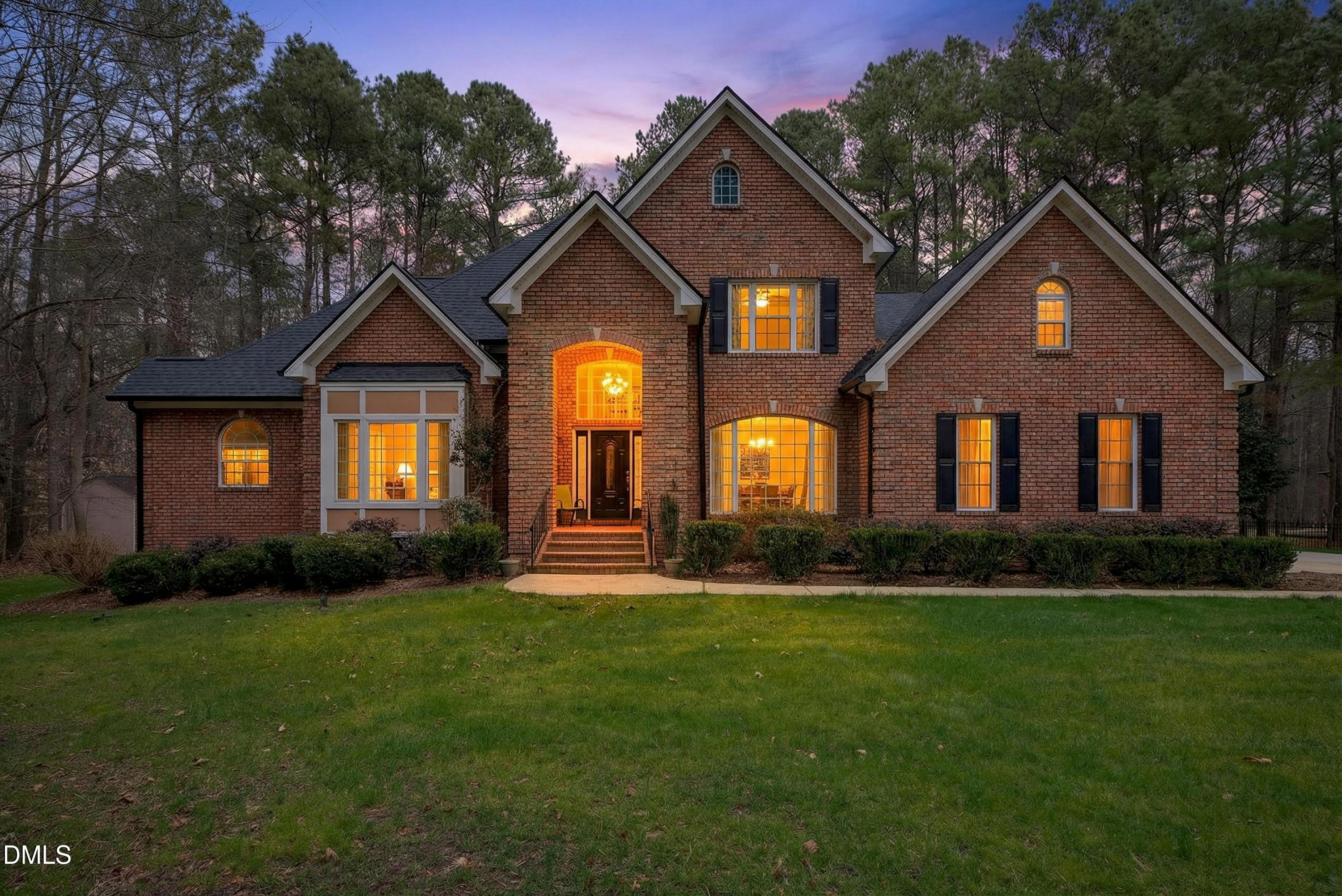 4613 Cross Brook Lane Raleigh, NC 27610 - Photo 4 of 53 a front view of a house with a yard