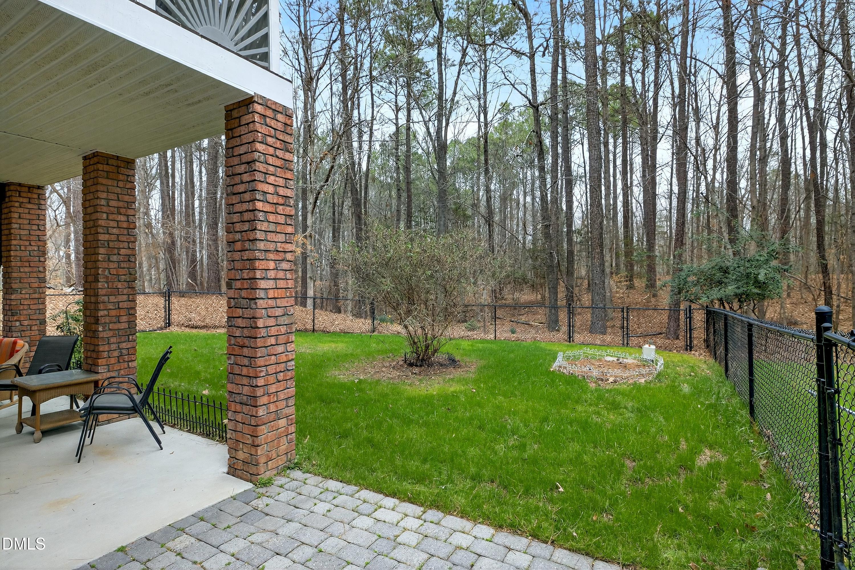 4613 Cross Brook Lane Raleigh, NC 27610 - Photo 45 of 53 a garden with chairs and a yard