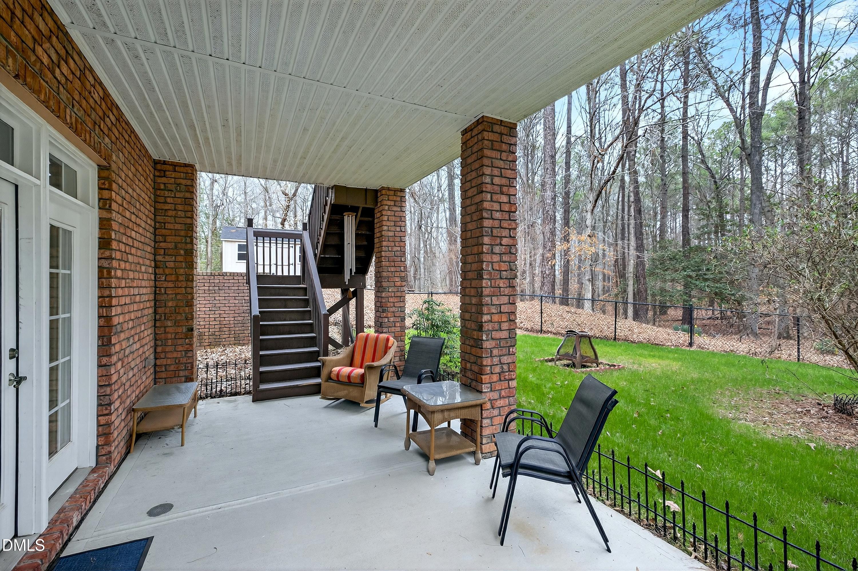 4613 Cross Brook Lane Raleigh, NC 27610 - Photo 46 of 53 a view of a patio with a table and chairs