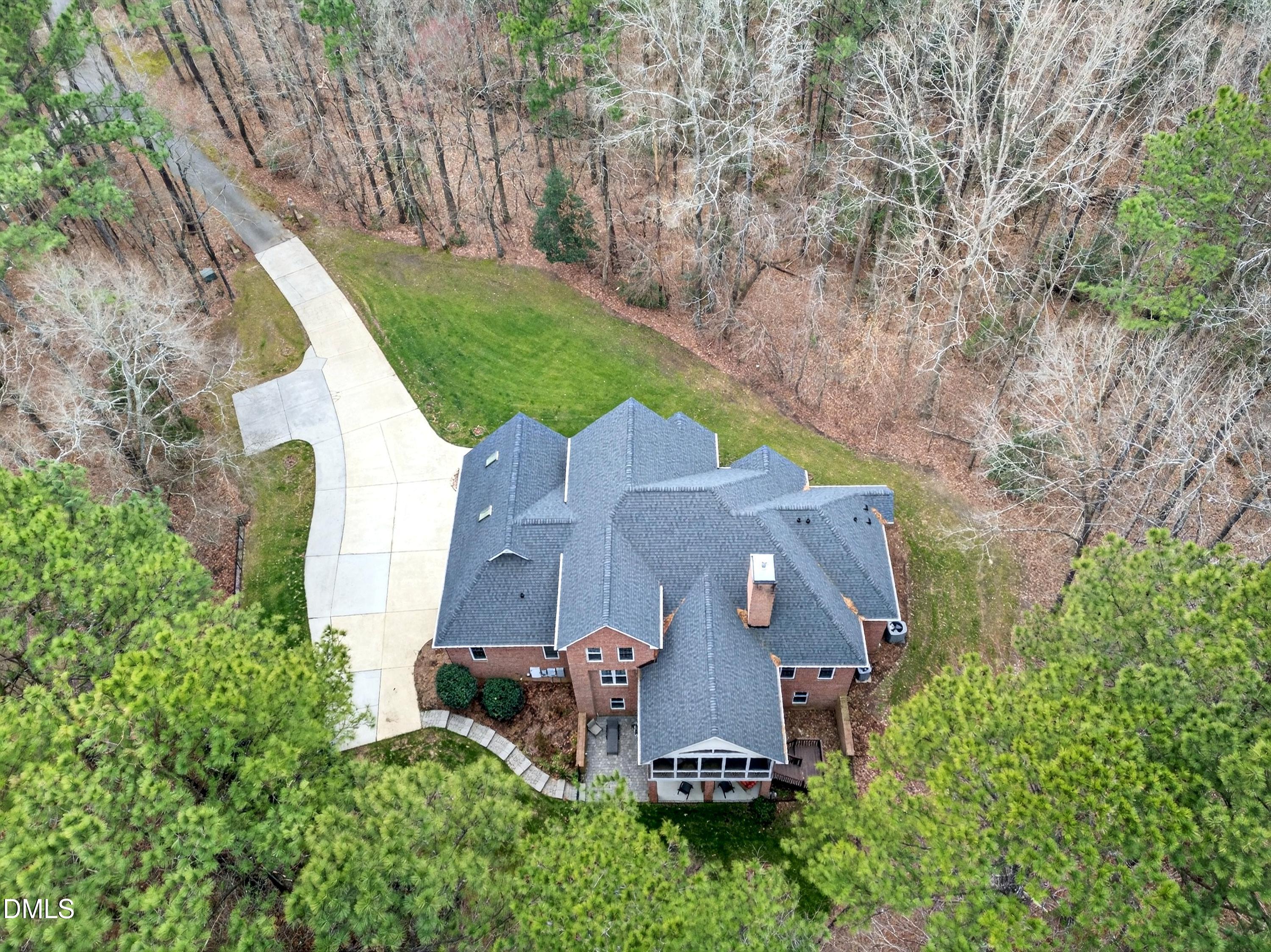 4613 Cross Brook Lane Raleigh, NC 27610 - Photo 49 of 53 an aerial view of a house with outdoor space and a lake view