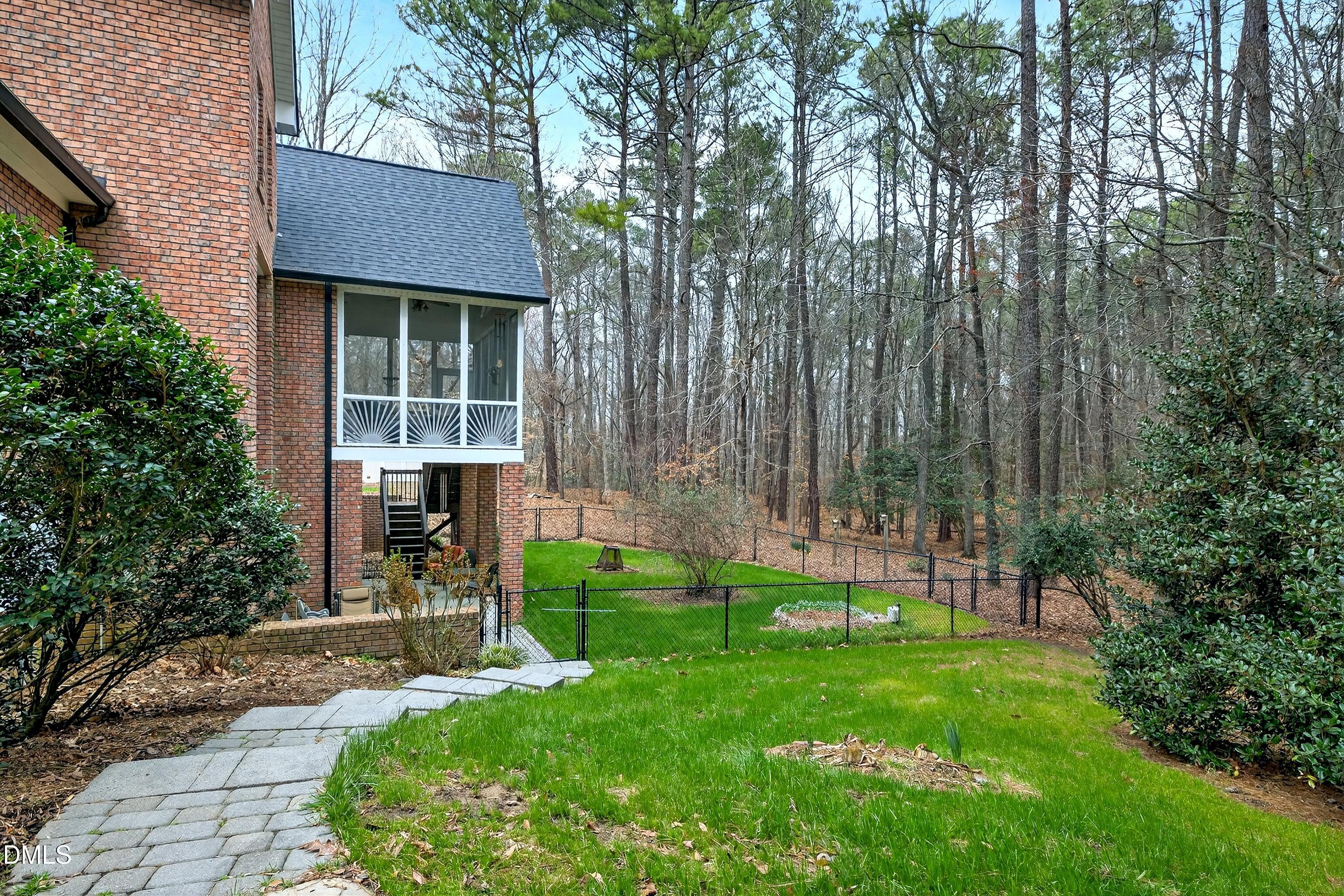 4613 Cross Brook Lane Raleigh, NC 27610 - Photo 52 of 53 a view of house with backyard and a garden