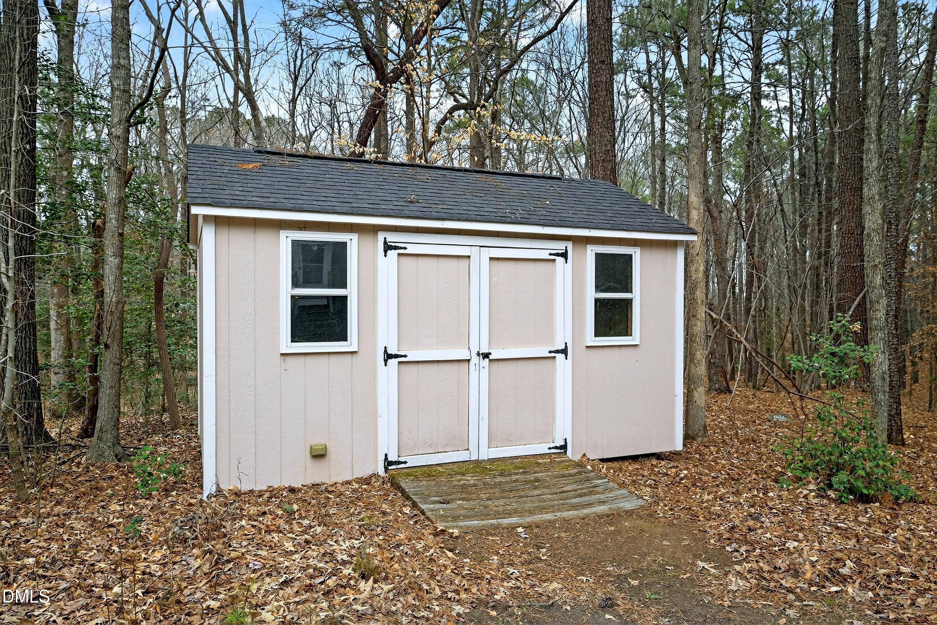 4613 Cross Brook Lane Raleigh, NC 27610 - Photo 53 of 53 a backyard of a house with lots of green space