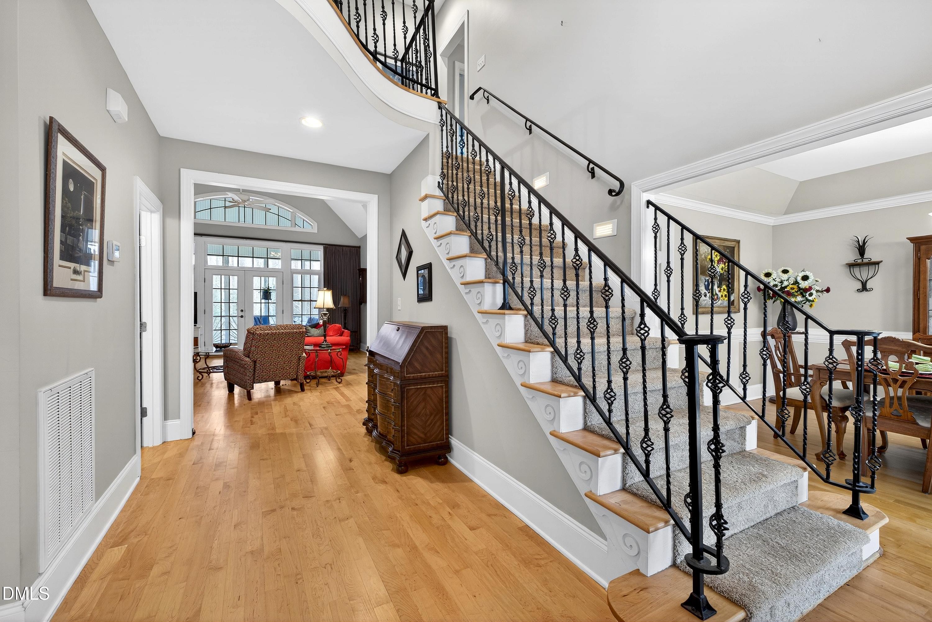 4613 Cross Brook Lane Raleigh, NC 27610 - Photo 6 of 53 a living room with wooden floor and stairs