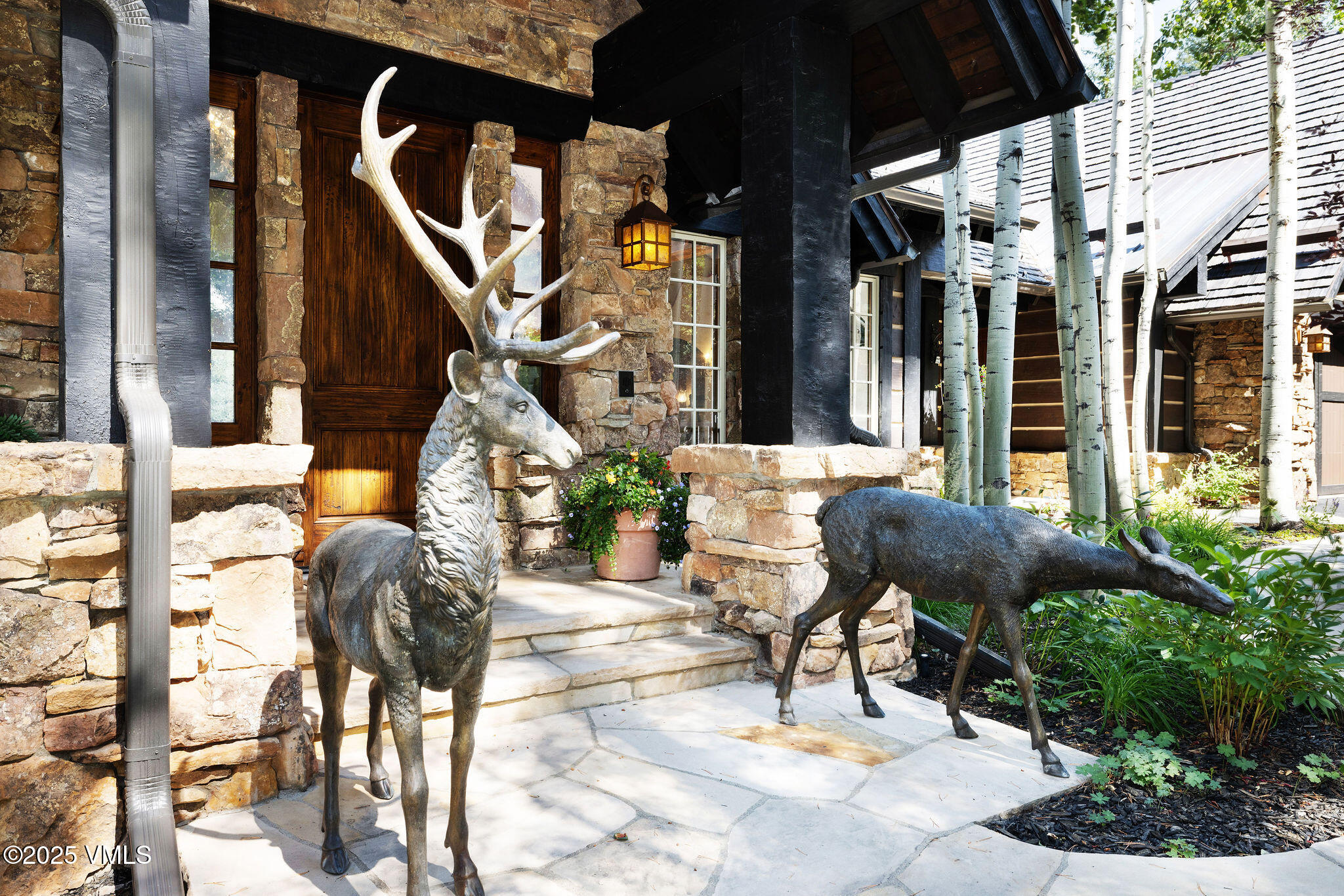 140 Elk Woods Road Edwards, CO 81632 - Photo 2 of 46 a building outdoor space with glass windows and couches
