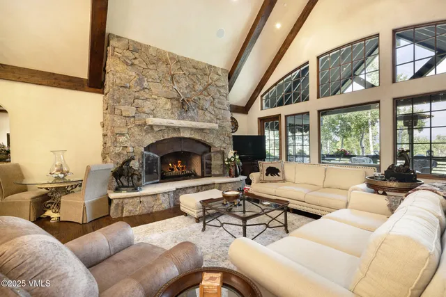 a living room with furniture a window and flowerpot