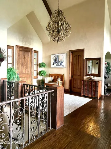 a view of a porch with furniture and a yard