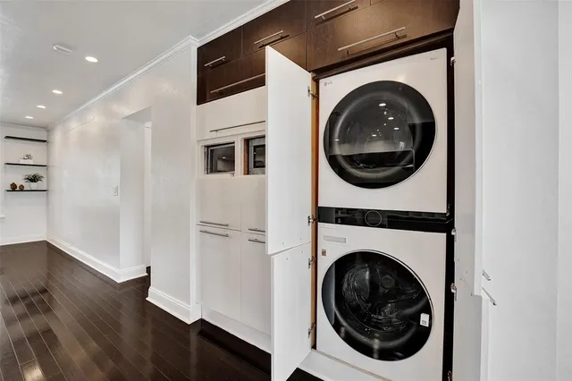 a view of a hallway with washer and dryer