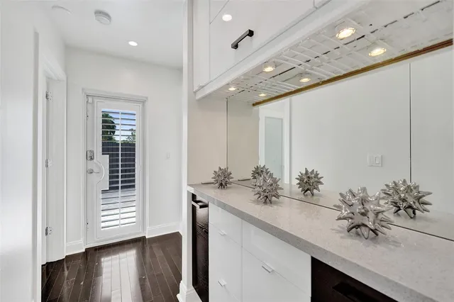 a bathroom with a double vanity sink and a mirror