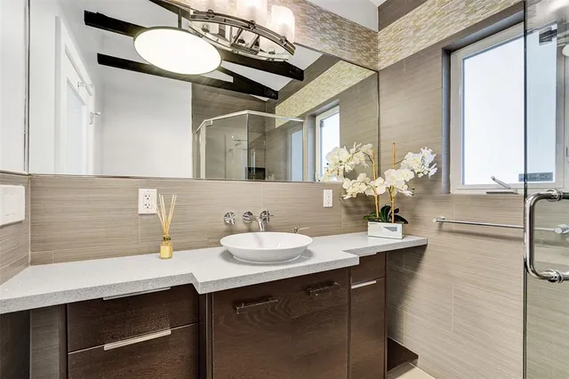 a bathroom with a sink and a mirror