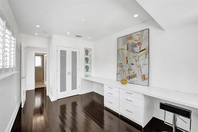 workspace with wooden floor and window