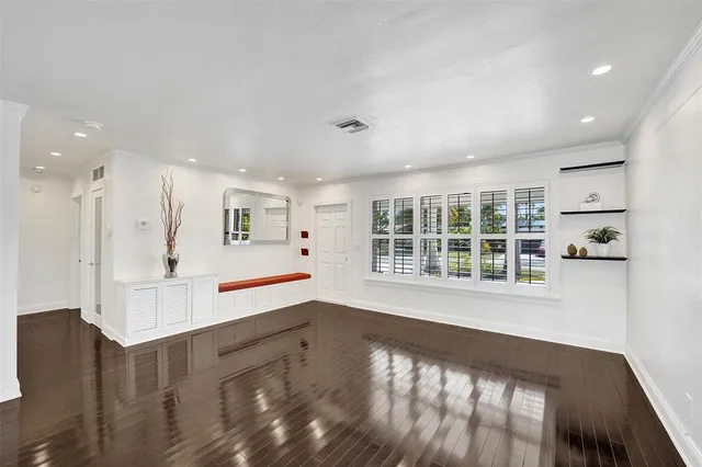 a view of a living room and kitchen with a large window