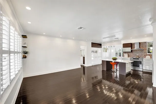 a view of kitchen with furniture and wooden floor