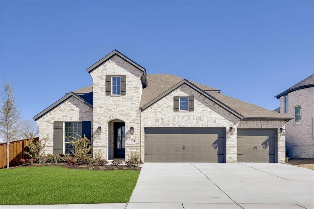 4425 Timberdrift Street Midlothian, TX 76065 - Photo 27 of 27 Light brick exterior with dark shutters, dual garage doors, and a concrete driveway