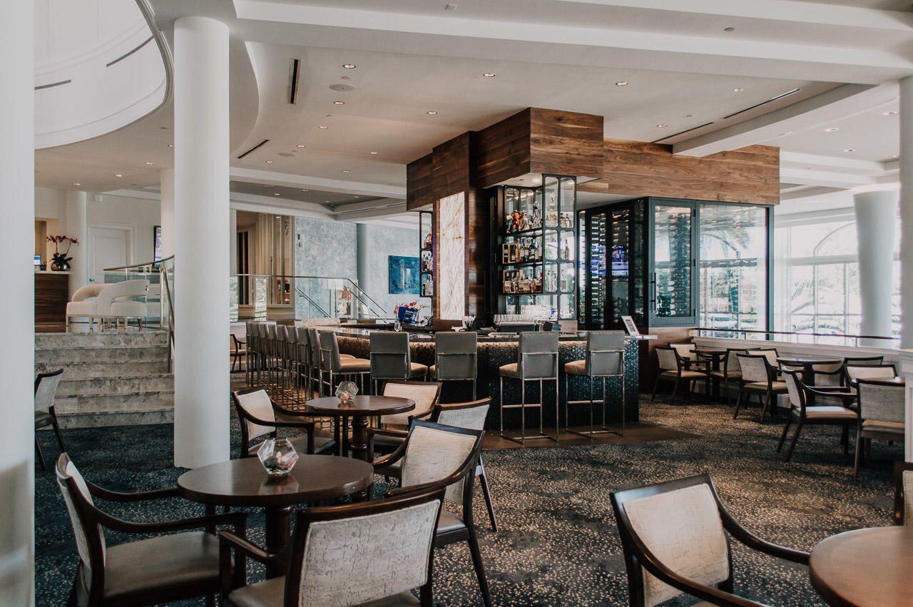 2001 Captains Way Jupiter, FL 33477 - Photo 5 of 20 a dining hall with furniture a large window and a potted plant