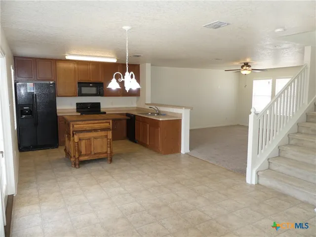 a room with a cabinets and window